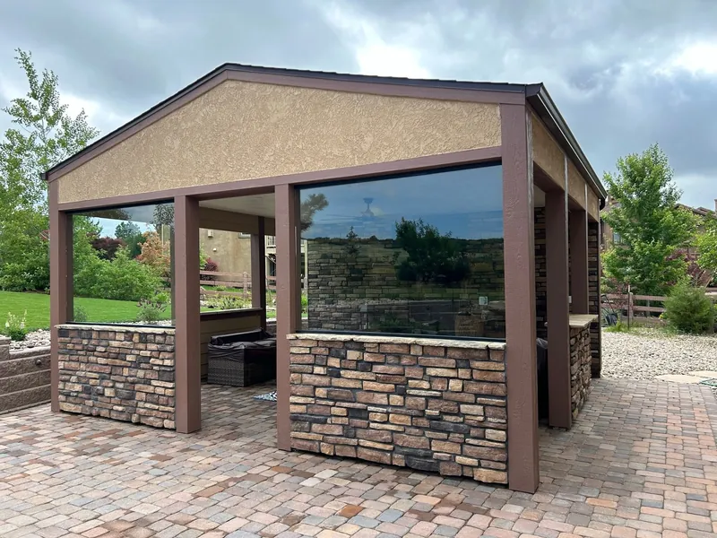 Stone pavilion enclosed with glass walls