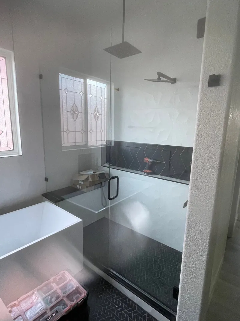 Frameless shower enclosure in a new build