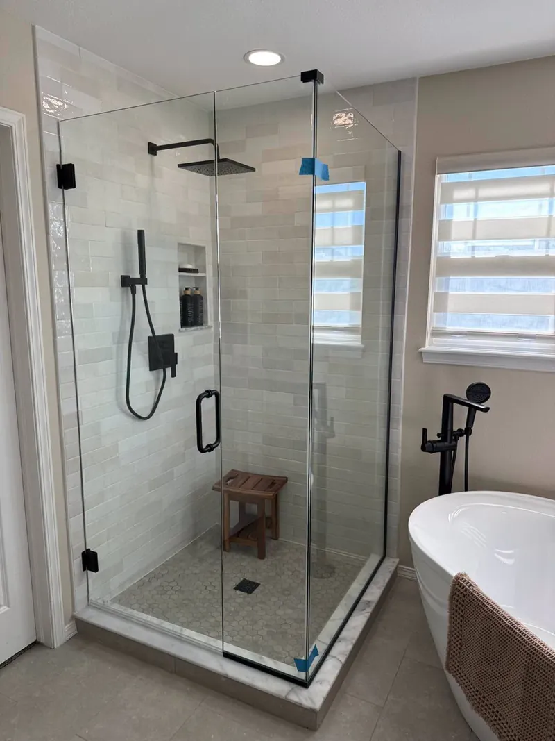 Corner shower with matte black hardware